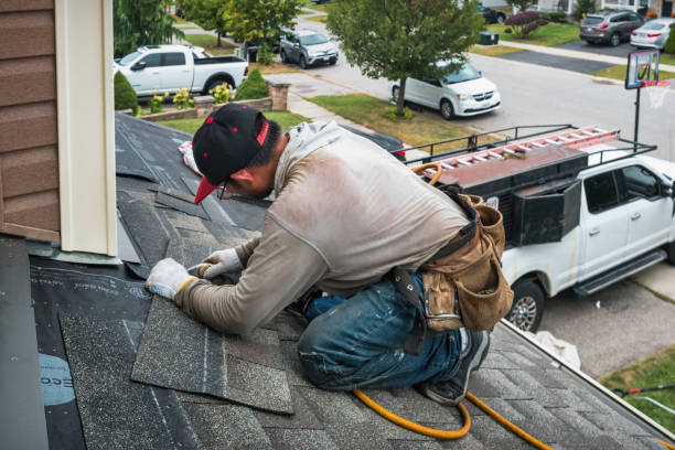 Professional Roofing technician working in Zion, IL